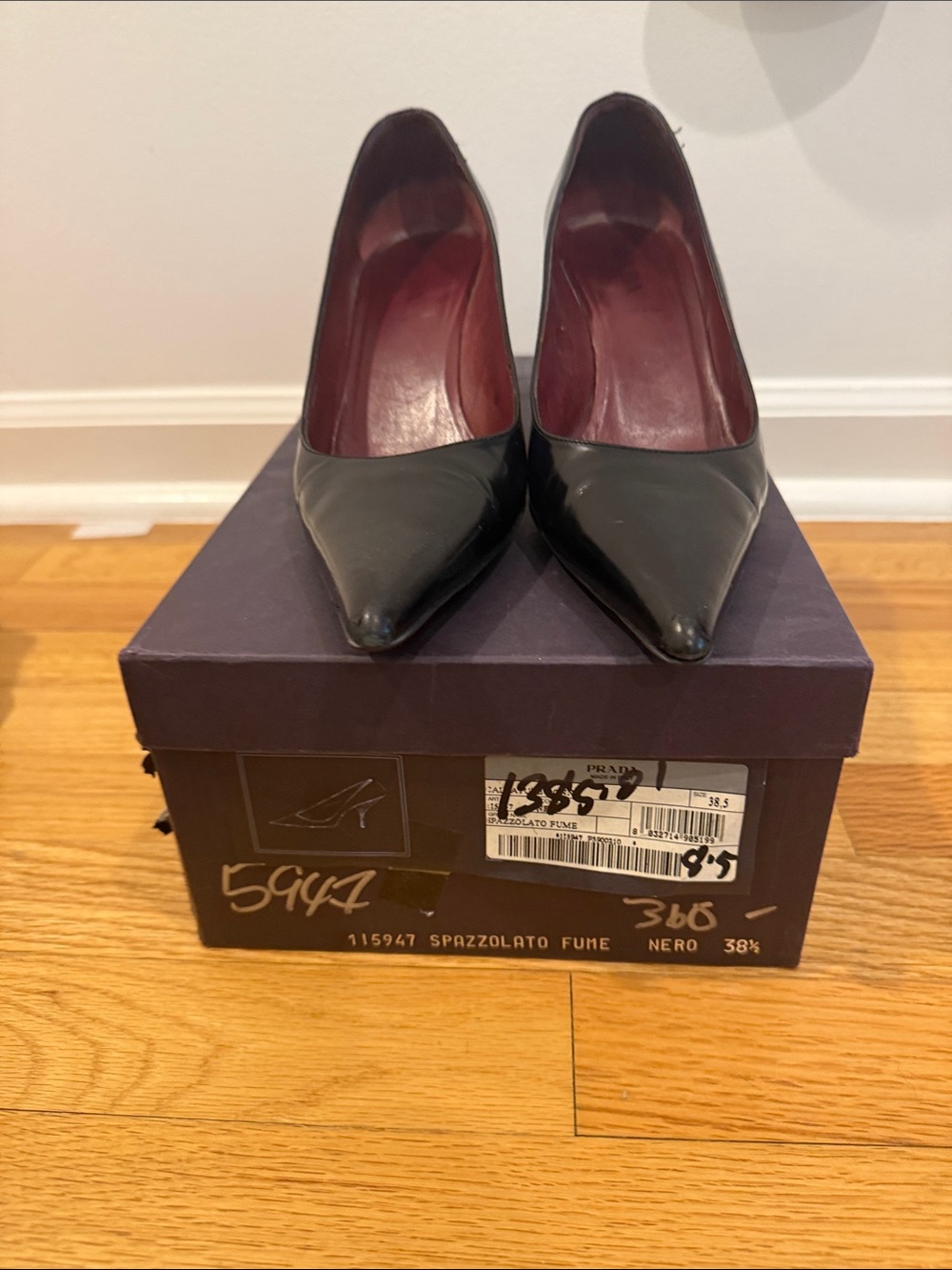 Prada Black Pointed Spazzolato Leather Pumps with Burgundy Lining
